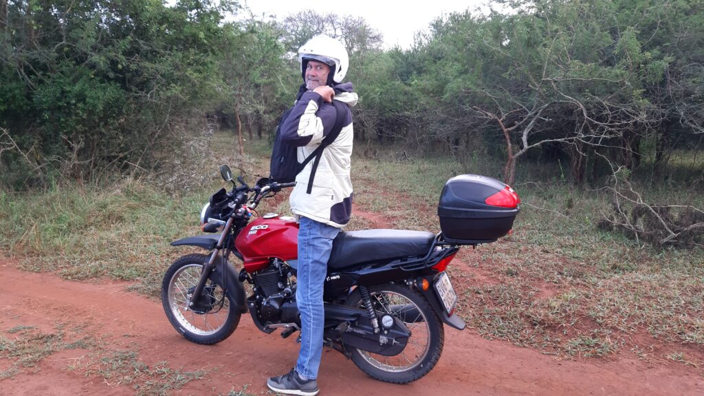 Brandon Smit from The Hoofermoo Project heading out on a motorbike to build free websites for rural business.